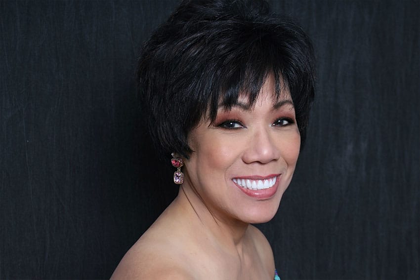 confident mature patient of Dr. Greens shows off her healthy smile