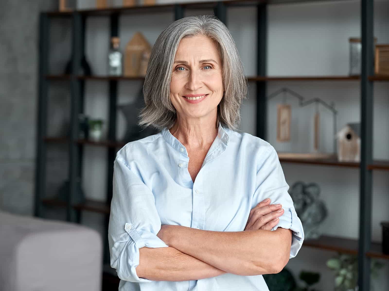 Mature woman smiling in living room