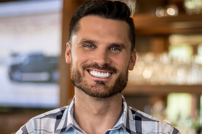 man with wide jaw shows off his smile