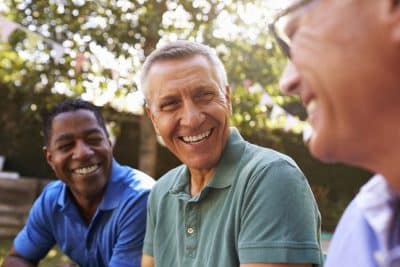 gentlemen with dental implants shows off their natural tooth replacement smiles