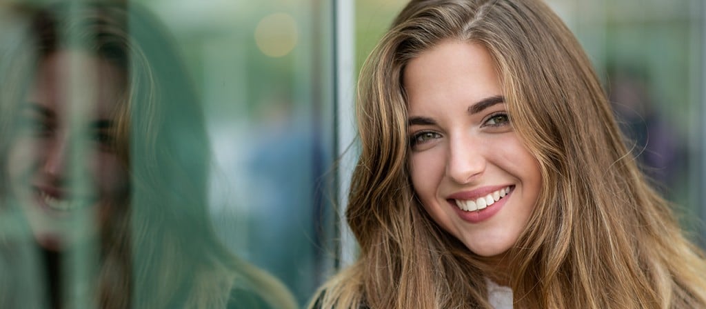 Woman showing off her beautiful smile.