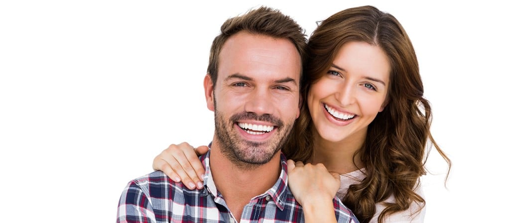 Couple smiling and hugging.