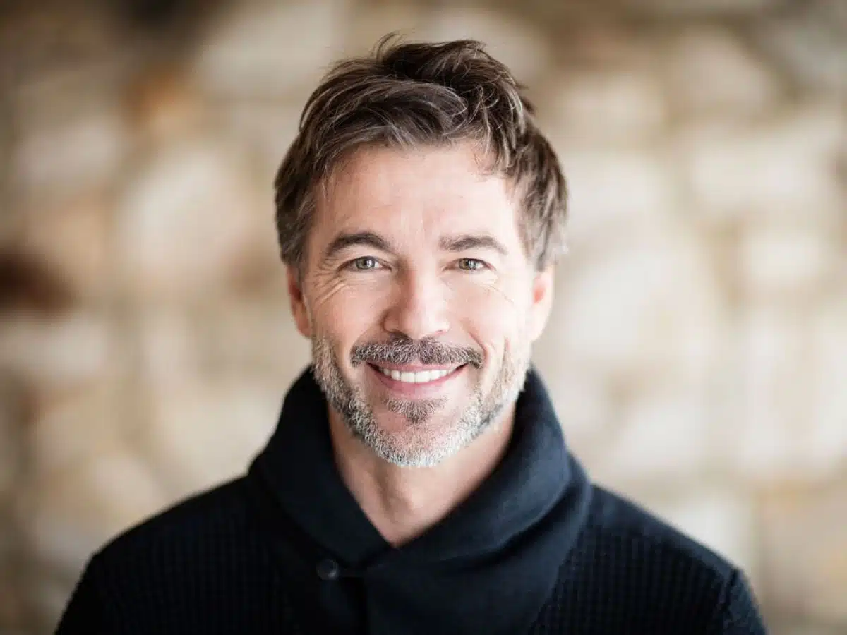 man-in-sweater-smiling-with-teeth