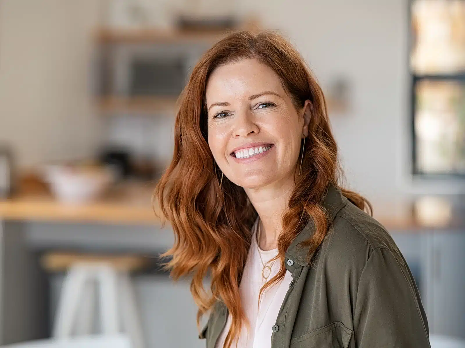 Woman with red hair smiling